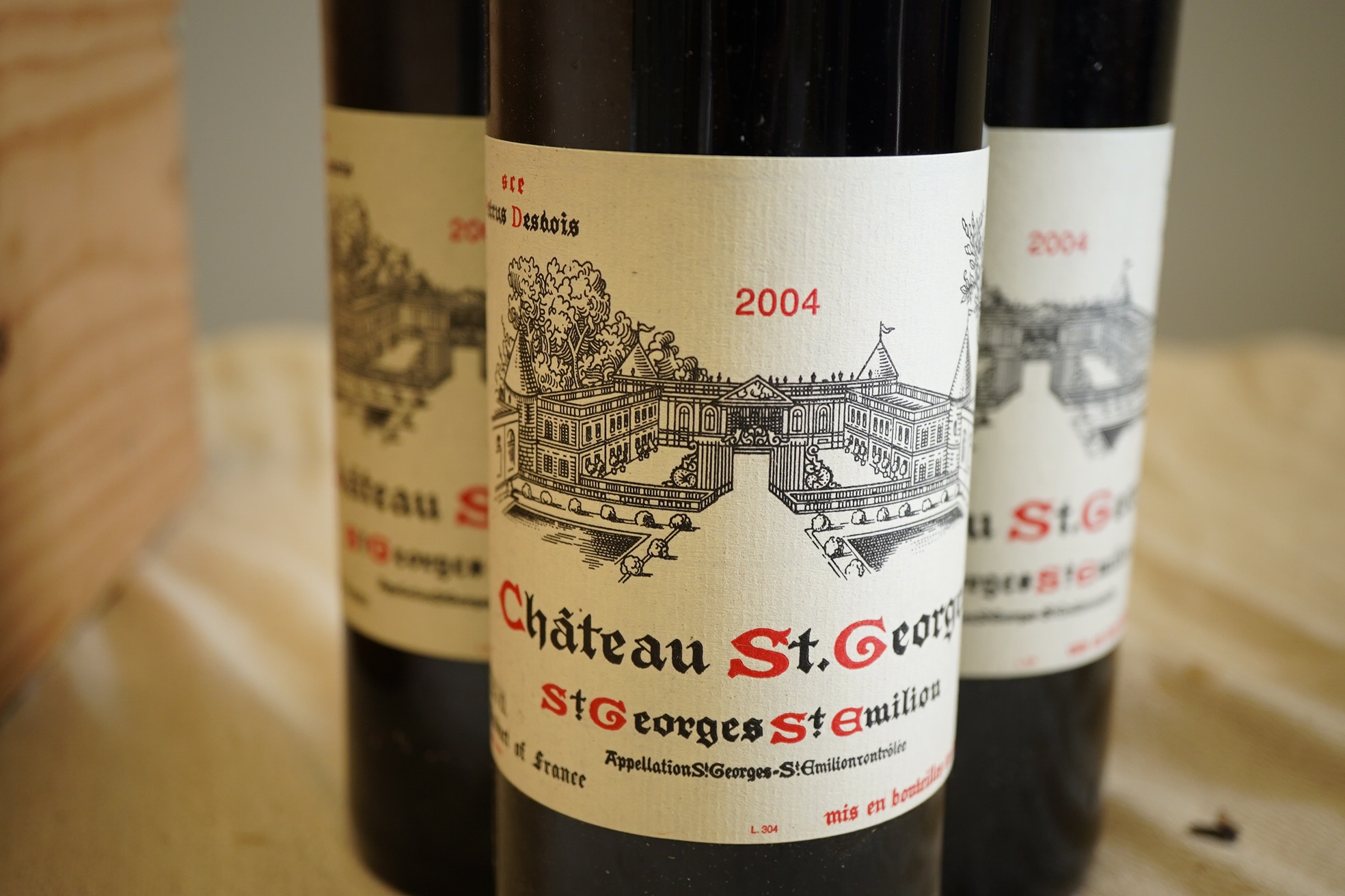 Twelve bottles of 2004 Chateau St. Georges St. Emilion (O.W.C but opened).